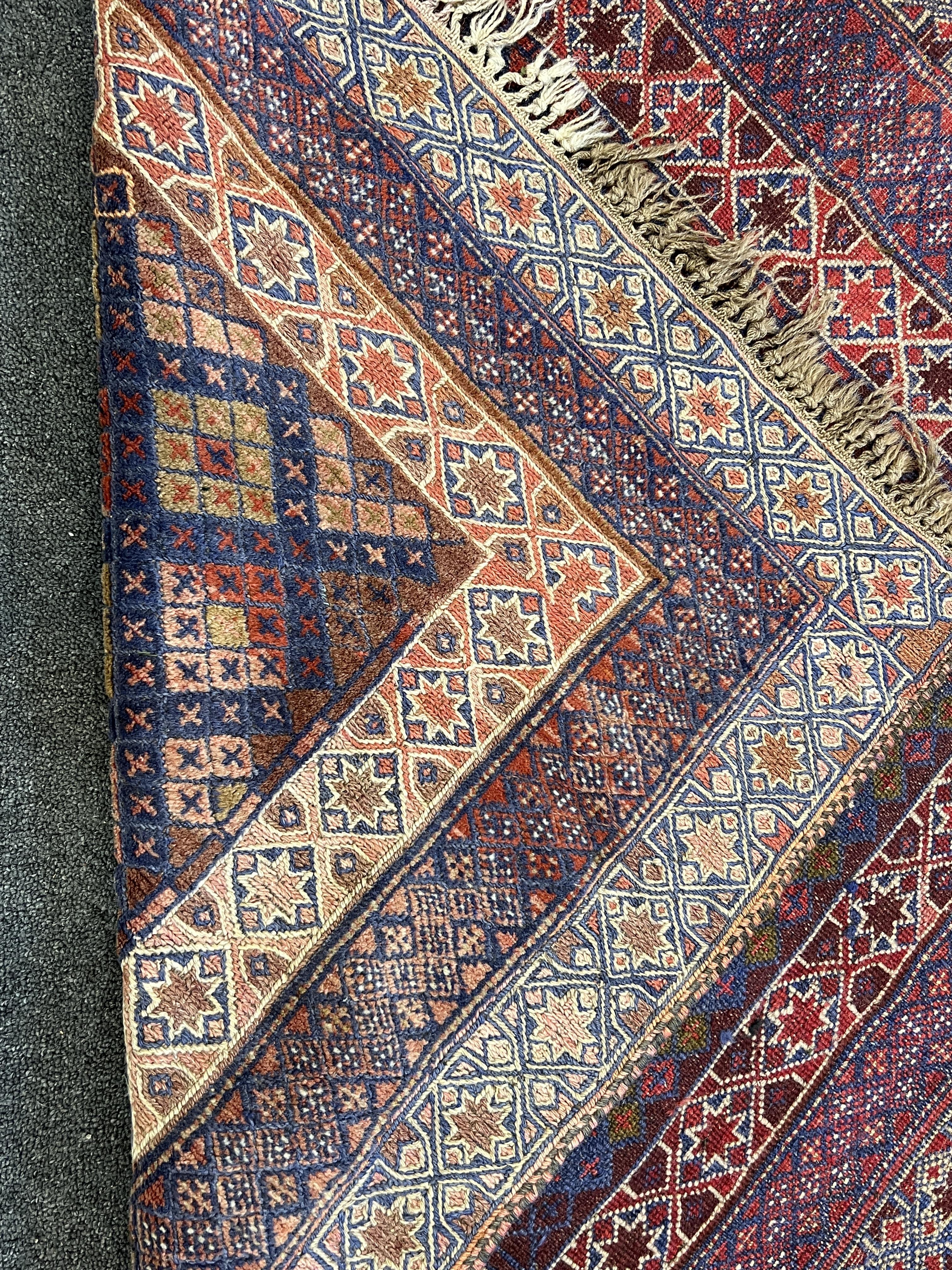 Two Afghan rugs / saddlebags, larger 104 x 108cm. Condition - fair